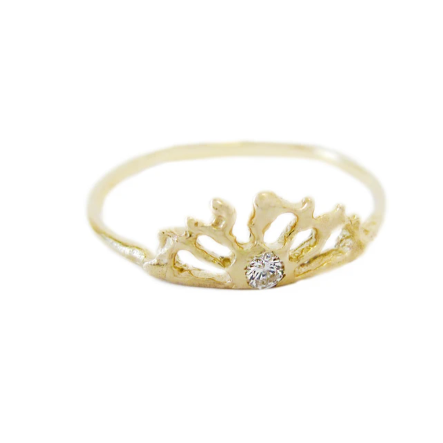 abstract sunrise gold ring with a diamond accent.