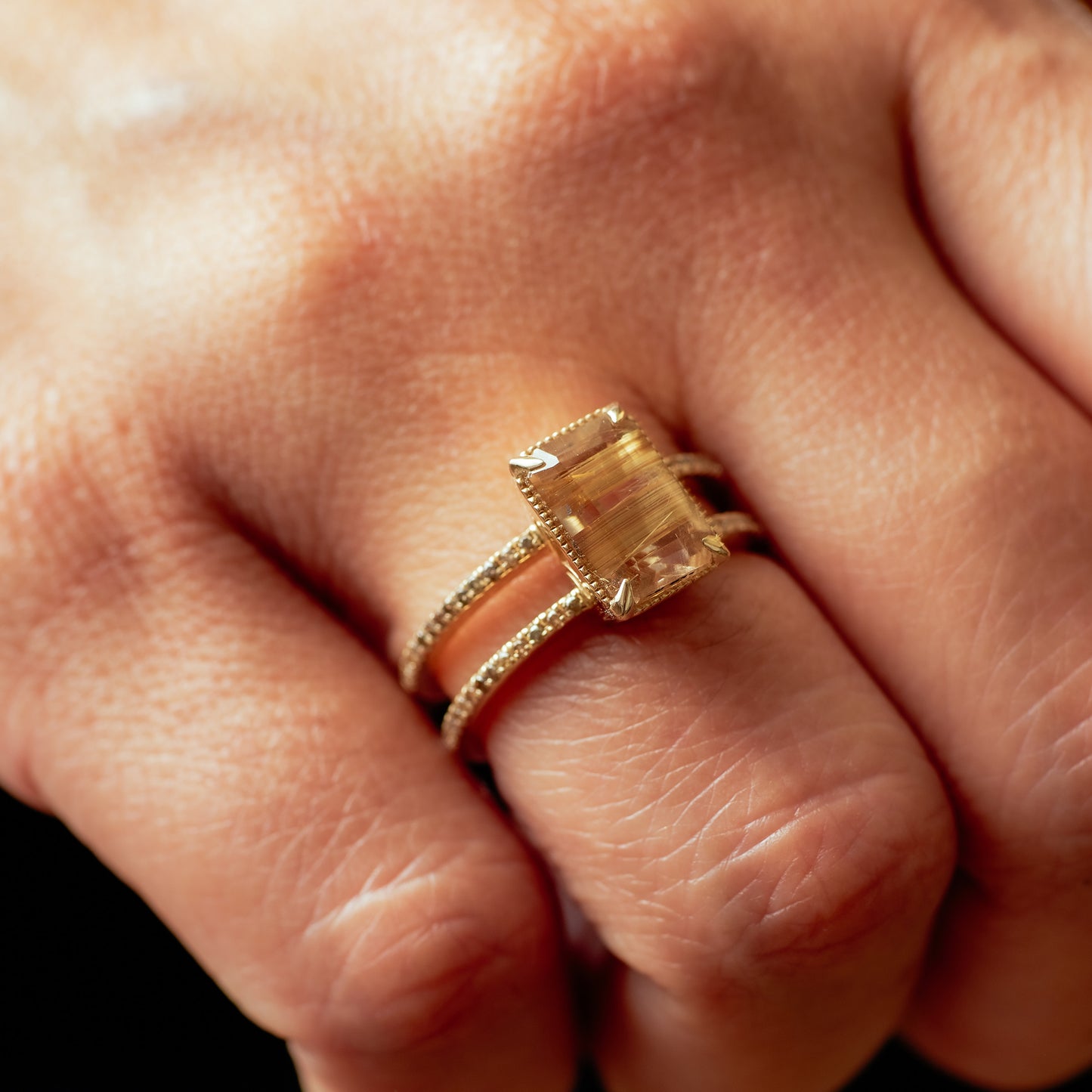 Double band Gisele ring with champagne diamonds and a gold rutile quartz on hand model.