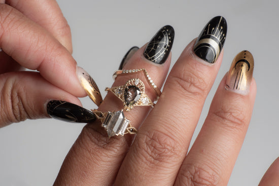 Load image into Gallery viewer, 3 diamond rings on a model&amp;#39;s hand
