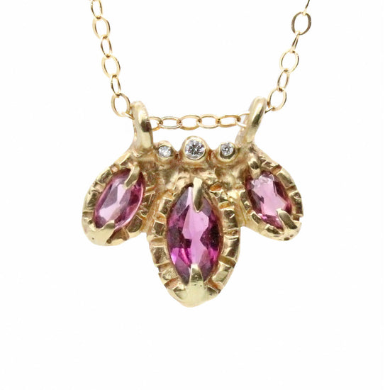 Load image into Gallery viewer, 3 purple marquis cut garnets, accompanied by diamonds, on gold chain pictured on white background
